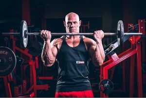 Home fitness fanatic Paul showing off his regimen by lifting weights.